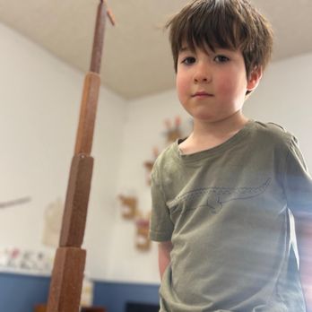 Glendale Montessori School - Preschool student proud of his work - Elementary Schools Near Me - Glendale, California