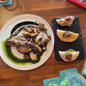 Rusty Pelican - Miami - Short Rib Empanadas and Grilled Herb Marinated Octopus - Seafood Near Me - Key Biscayne, Florida Rusty Pelican - Miami - Short Rib Empanadas and Grilled Herb Marinated Octopus - Seafood Near Me - Key Biscayne, Florida