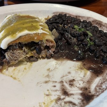 Cantina 109 - What's leftover of my chicken "wet" burrito w/ verde sauce and black beans. So good! - Tex-Mex Near Me - Fort Myers, Florida Cantina 109 - What's leftover of my chicken "wet" burrito w/ verde sauce and black beans. So good! - Tex-Mex Near Me - Fort Myers, Florida