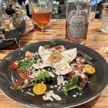 Barrel and Fork - Burrata salad, interesting that they open the burrata and place a piece of honeycomb in the center, and then drizzle it with honey. - American Near Me - Cornelius, North Carolina Barrel and Fork - Burrata salad, interesting that they open the burrata and place a piece of honeycomb in the center, and then drizzle it with honey. - American Near Me - Cornelius, North Carolina