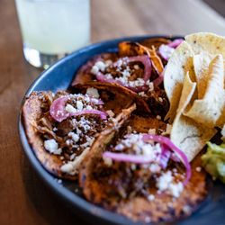 Goat birria tacos from the 'We Go South' menu. Perfectly paired with a margarita!
