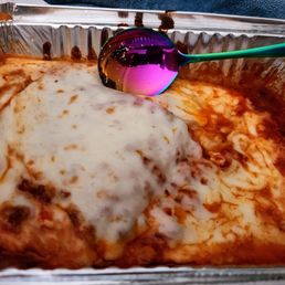 The spoon pictured is a tablespoon so you can see how small and short piece of lasagna was I ordered extra Mozzarella on it. The spoon pictured is a tablespoon so you can see how small and short piece of lasagna was I ordered extra Mozzarella on it.