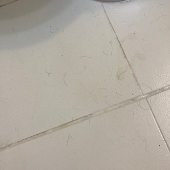 Scrub! Residential Cleaning - hair and smudges left on tile floor - Home Cleaning Near Me - Philadelphia, Pennsylvania