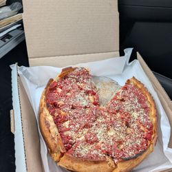 Nancy's Pizza O'Fallon - Stuffed Crust (Deep dish)... Had to grab a slice in the car