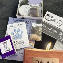 Cremation box, clay paw prints, and included extras Cremation box, clay paw prints, and included extras