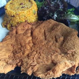 Breaded beef, rice and green peas. Breaded beef, rice and green peas.