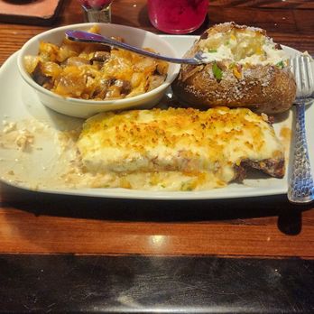 LongHorn Steakhouse - Parmesean New York strip with loaded bake potato and mushrooms and onions on the side. - Steakhouses Near Me - Mishawaka, Indiana LongHorn Steakhouse - Parmesean New York strip with loaded bake potato and mushrooms and onions on the side. - Steakhouses Near Me - Mishawaka, Indiana