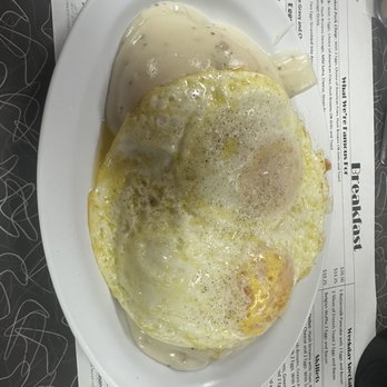 Yellow Cat Cafe - 2 Biscuits and Sausage Gravy with fried 2 Eggs Any Style - Breakfast & Brunch Near Me - South Bend, Indiana