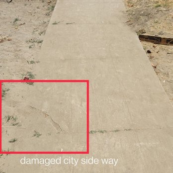 Joseph Construction - a sidewalk with a stop sign in the background - General Contractors Near Me