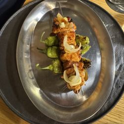Chicken skewer on pepper