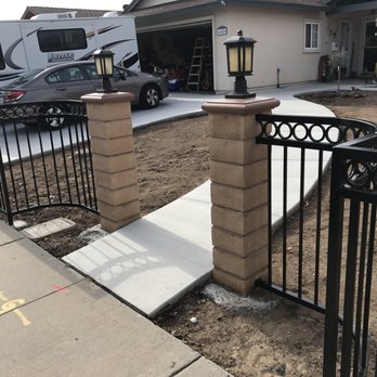 Garage Door Solutions - Soft curve around water meter that really made our new fence look really nice - Garage Door Services Near Me - New York, New York Garage Door Solutions - Soft curve around water meter that really made our new fence look really nice - Garage Door Services Near Me - New York, New York