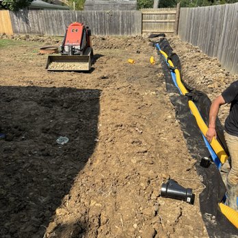 Mario's Land Management - Making sure that the drain was placed correctly and in the depth needed. - Excavation Services Near Me Mario's Land Management - Making sure that the drain was placed correctly and in the depth needed. - Excavation Services Near Me