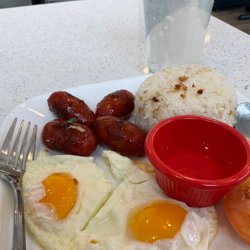 Roc's Grill - Longsilog (Filipino sweet sausage) with sunny side up eggs and garlic rice, tomato garnish