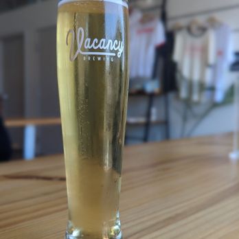 Vacancy Brewing - a glass of beer on a table - Breweries Near Me - Austin, Texas Vacancy Brewing - a glass of beer on a table - Breweries Near Me - Austin, Texas
