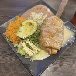 Braves Pancakes House & Restaurant - I ordered the chicken chimichanga with rice, beans and queso!