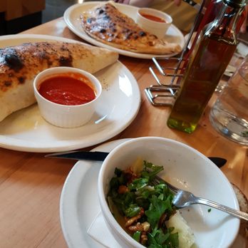 Pizzeria Libretto - Yummy calzone with arugula salad - Pizza Near Me - Toronto, Ontario