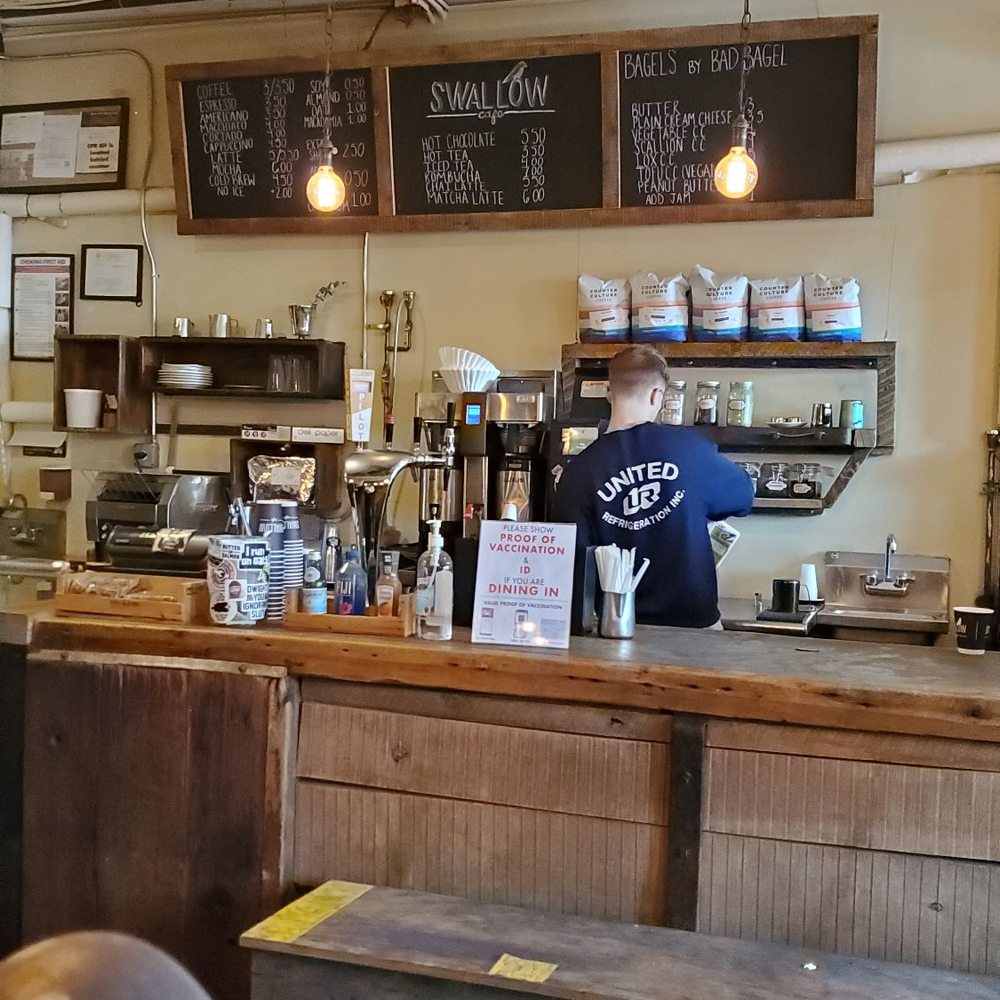 Swallow Cafe - a man working behind the counter - Coffee & Tea Near Me - Brooklyn, New York