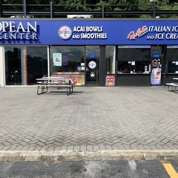 SoBoL - A storefront in a shopping plaza features signs for acai bowls, smoothies, and ice cream, with glass windows and a door, and outdoor seating. - Juice Bars & Smoothies Near Me - Yonkers, New York