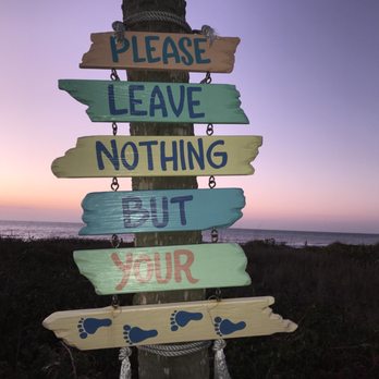 Indian Rocks Beach - Please leave nothing but your foot-prints sign after sunset at Indian rocks beach - Beaches Near Me - Indian Rocks Beach, Florida