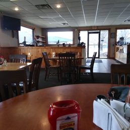 a table with a jar of ketchup a table with a jar of ketchup