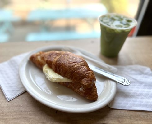 Photo of Ugly Mug Cafe & Coffee Roasters - U District - Seattle, WA, US. Egg Croissant Egg Sandwich & Matcha Latte