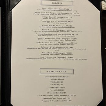 Chaplin's - A menu page featuring a selection of champagnes and whiskeys, including Veuve Clicquot, Perrier Jouet, and Yamazaki, with descriptions and prices. - Cocktail Bars Near Me - Washington, DC, District of Columbia