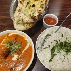 Tandoori Oven - Lamb Tikka Masala w Garlic Naan bread, indian rice and hot sauce on side.
