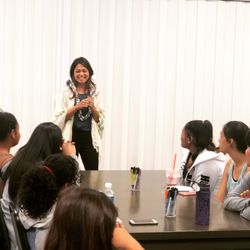 Brandi Kiana-Jo - Coach Brandi speaking at event for teenagers