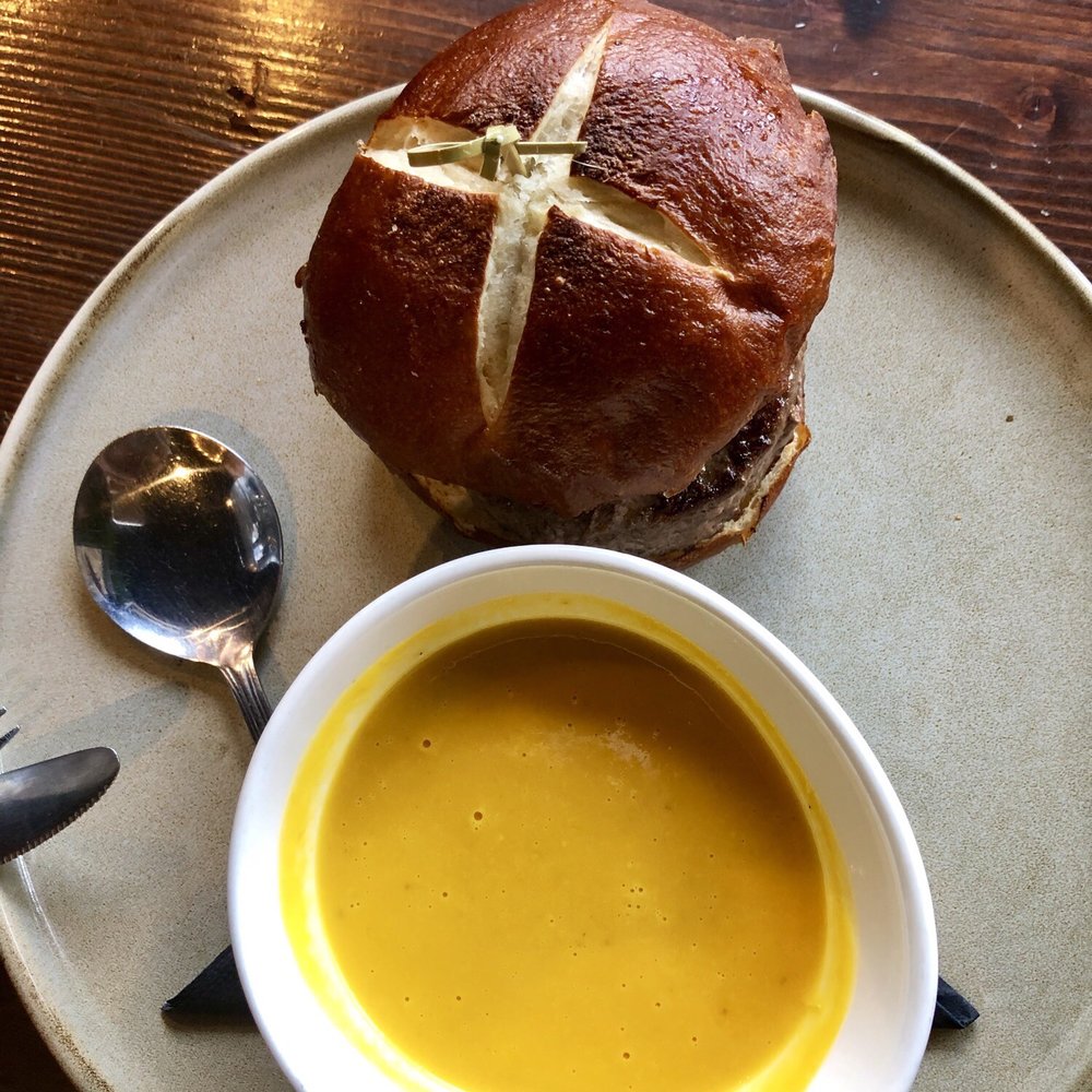 Graze - Tex Mex burger with squash soup (top view) - Bars Near Me - Canmore, Alberta