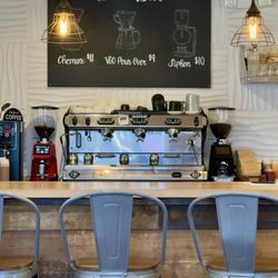 Deep Barrel Roasters & Creamery - Bar top area with Brew Bar sign and prices.