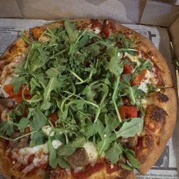 Delicious pizza with arugula