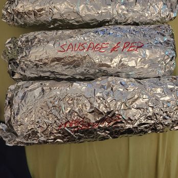1012 Kitchen - three wrapped sandwiches on a plate - Sandwiches Near Me - Brooklyn, New York 1012 Kitchen - three wrapped sandwiches on a plate - Sandwiches Near Me - Brooklyn, New York