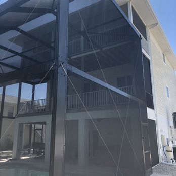 Topla - Screen Enclosures / Aluminum Design - 2 Story Panoramic-view screen enclosure - Patio Coverings Near Me - Fort Myers, Florida Topla - Screen Enclosures / Aluminum Design - 2 Story Panoramic-view screen enclosure - Patio Coverings Near Me - Fort Myers, Florida