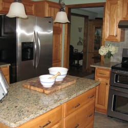 Eco Chic Interiors - Redesigning the placement of cabinets enhanced the flow and added extra workspace.