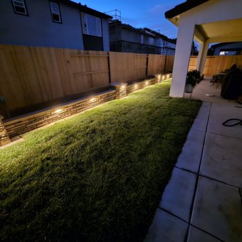 NT Landscaping Service - Backyard at night with wall lights on - Landscaping Near Me - Elk Grove, California