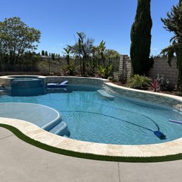 pool with travertine coping and ledgerstone wall