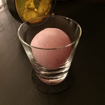 The Aviary - In The Rocks (the drink is inside the ice cube shaped egg. You have to use a sling to crack it open for your drink) - Cocktail Bars Near Me - Chicago, Illinois The Aviary - In The Rocks (the drink is inside the ice cube shaped egg. You have to use a sling to crack it open for your drink) - Cocktail Bars Near Me - Chicago, Illinois