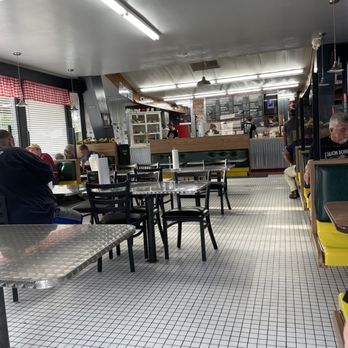 Biemer's BBQ - a man sitting at a table - Barbeque Near Me - Lawrence, Kansas Biemer's BBQ - a man sitting at a table - Barbeque Near Me - Lawrence, Kansas