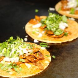 Taco’n Madre Grill - Tacos de asada. Top with green or red salsa.