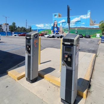 USPS - Digital "smart" parking meters with a beautiful Tongva mural in the background. - Post Offices Near Me - North Hollywood, California