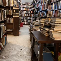 Abraxas Books - Stacks of books