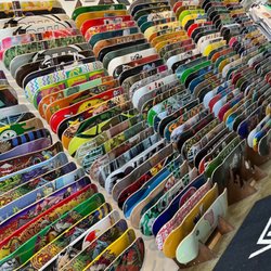Skateboard wall that is always being replenished with the latest and greatest in skateboarding companies.