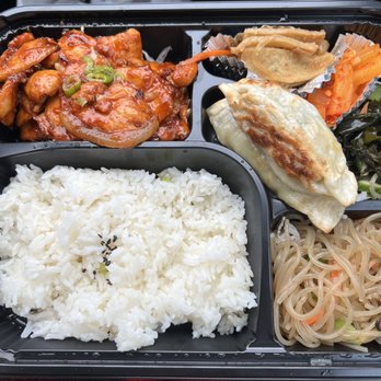 Dosirak Express - Spicy chicken box with japchae, pan fried dumplings, fish cake, radish and seaweed salad. - Korean Near Me - Irvine, California Dosirak Express - Spicy chicken box with japchae, pan fried dumplings, fish cake, radish and seaweed salad. - Korean Near Me - Irvine, California