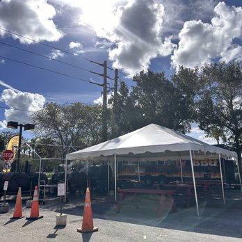 Jones Old School BBQ - a white tent set up in a parking lot - Barbeque Near Me - Port St Lucie, Florida