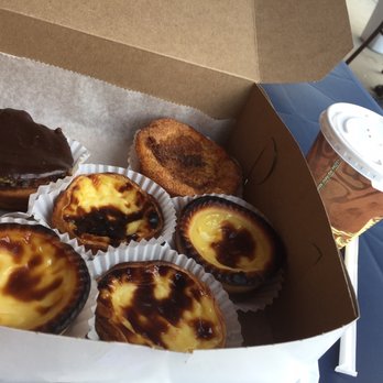 Pao Da Terra Bakery - Pasteis de nata, like rice cake with cinnamon sugar & the choco top has a thick dense crust with custard & light cream - Bakeries Near Me - Newark, New Jersey Pao Da Terra Bakery - Pasteis de nata, like rice cake with cinnamon sugar & the choco top has a thick dense crust with custard & light cream - Bakeries Near Me - Newark, New Jersey