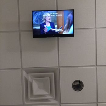 Forest Family Dentistry - Parks and Rec on the ceiling TV! - Cosmetic Dentists Near Me - Austin, Texas