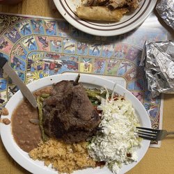 La Fogata - I plate of buffet and a plate of carne asada with enchiladas