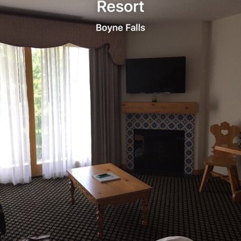 Mountain Grand Lodge and Spa - The tv and fireplace - Hotels Near Me - Boyne Falls, Michigan Mountain Grand Lodge and Spa - The tv and fireplace - Hotels Near Me - Boyne Falls, Michigan