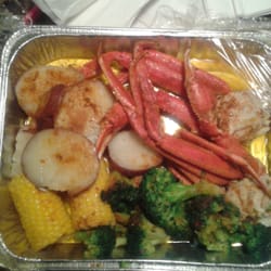 Alaskan crabs with potatoes, broccoli and corn