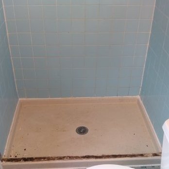 Surface Raiders - a bathroom with a toilet and shower - General Contractors Near Me Surface Raiders - a bathroom with a toilet and shower - General Contractors Near Me